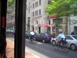 a stream of police officers on bikes, on K St. NW